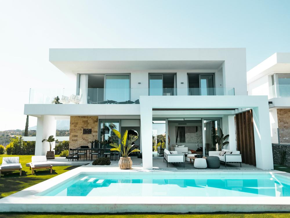 White contemporary villa with a pool